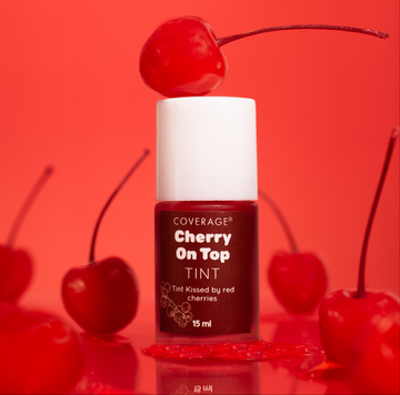 COVERAGE® Cherry Tint swatched on lips — buildable red tint