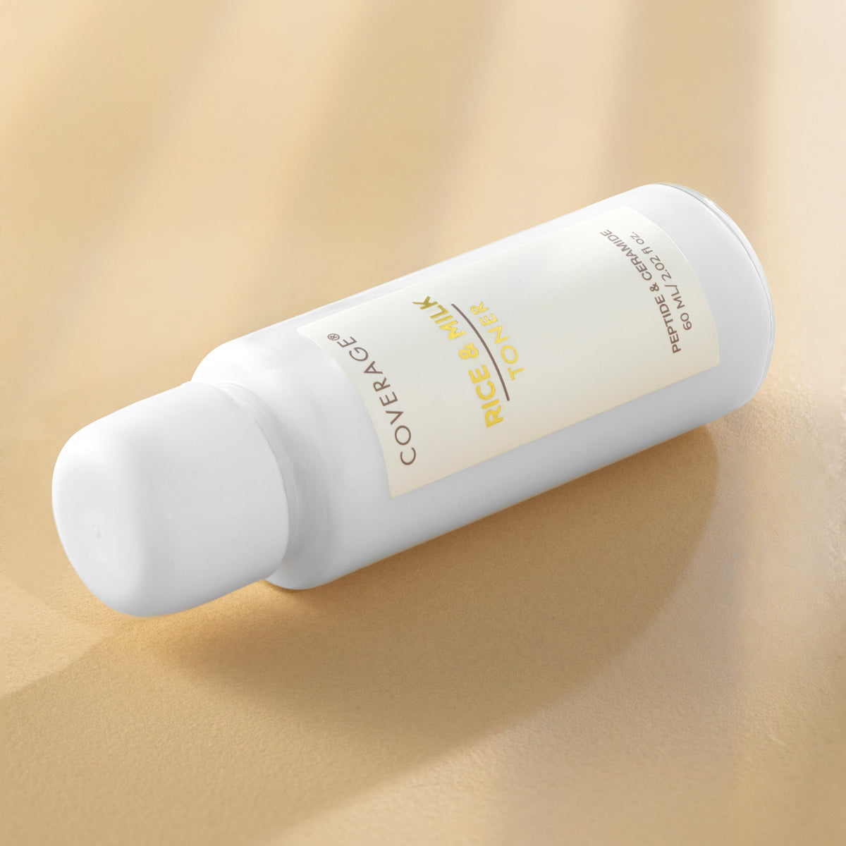 COVERAGE® Rice & Milk Toner 60ml bottle close-up — milky hydrating toner for dry, dull and dehydrated skin in Pakistan