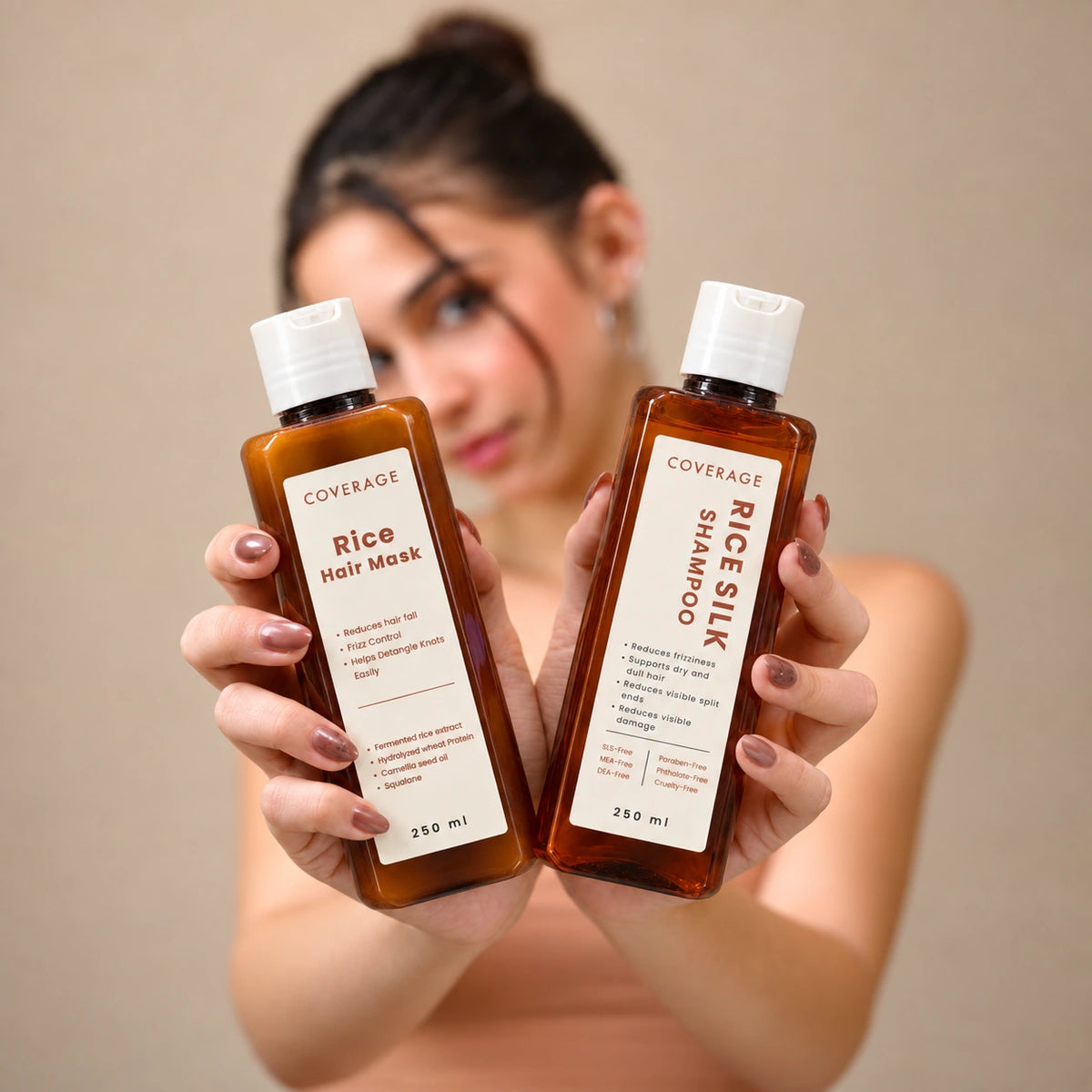 Model holding COVERAGE Rice Silk Shampoo and Rice Hair Mask - Shine & Silk Hair Duo for smooth, shiny hair in Pakistan